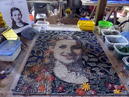 Luana mosaic is being built on the bench