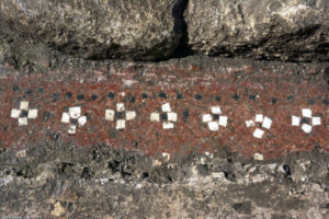 Croisettes made of white and black tesserae adorning an antique floor opus signinum discovered in Uzès (