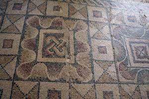 The waves of the border are characteristic of the regional mosaic style developped by the Aqquitaine school of mosaics